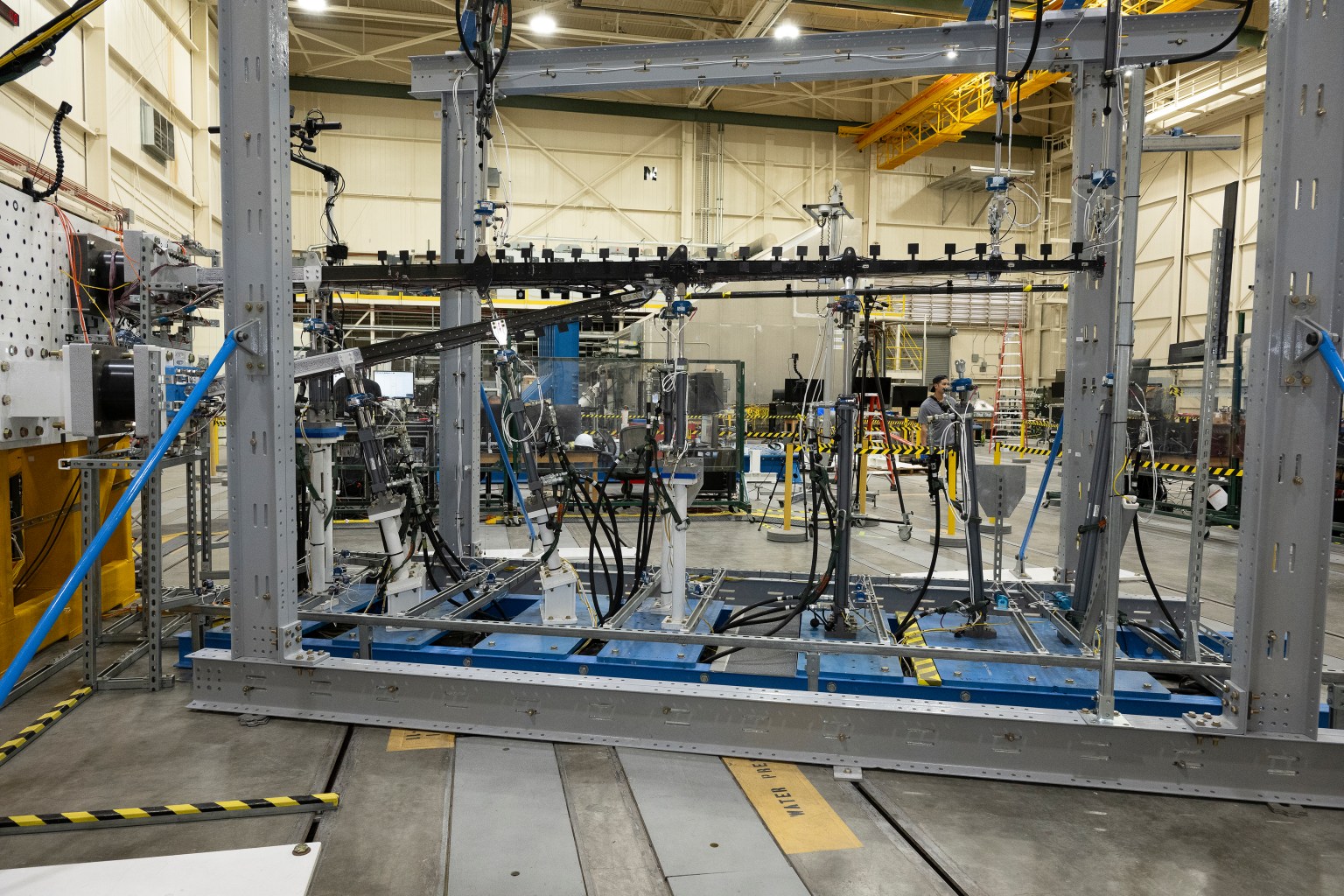 NASA team preparing the SWEET-15 truss-braced wing model in the Flight Loads Laboratory
