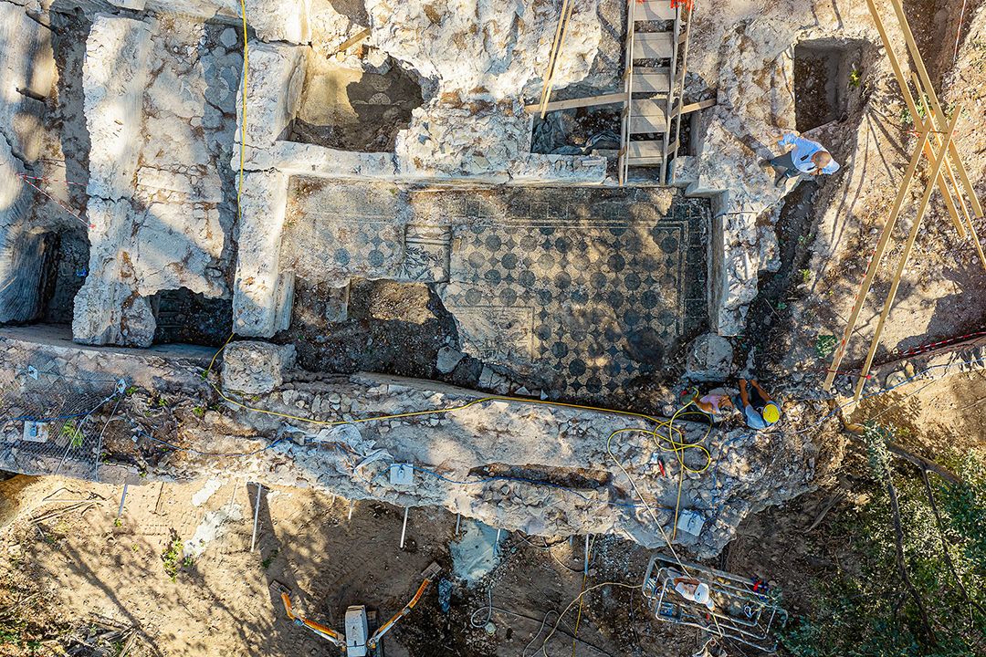 Excavations in Rome uncovered a building near the Colosseum from the second century C.E. with mosaics and frescoes.